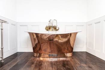 ROYAL COPPER BATH WITH WHITE INTERIOR.